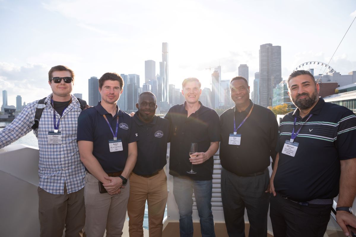 Attendees smiling on boat cruise